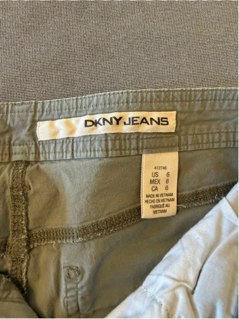 olive green DKNY Jeans women's roll-up tab shorts size 6